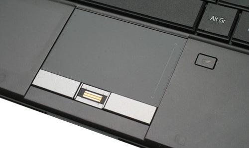 Close-up of Acer TravelMate laptop touchpad and fingerprint reader