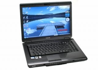 Toshiba Satellite L300-29T laptop with open lid displaying desktop wallpaper