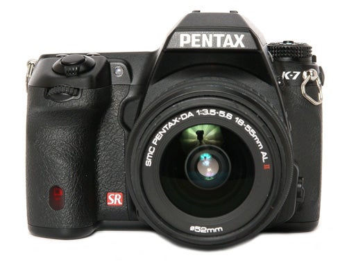 Pentax K-7 DSLR camera with a zoom lens attached.