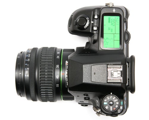 Pentax K-7 DSLR camera with lens from top view.