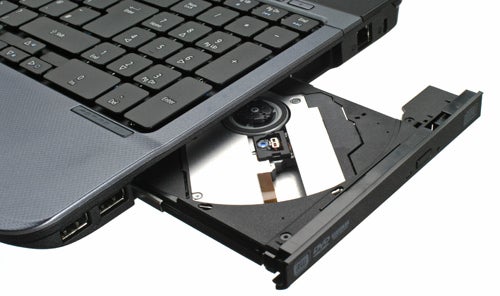 Acer Aspire 5536 laptop with open DVD drive.