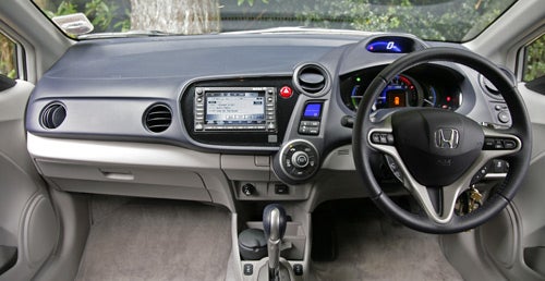 Interior dashboard view of Honda Insight 1.3 ES-T Hybrid vehicle.