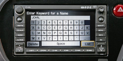 Honda Insight's navigation system screen with keyboard display.