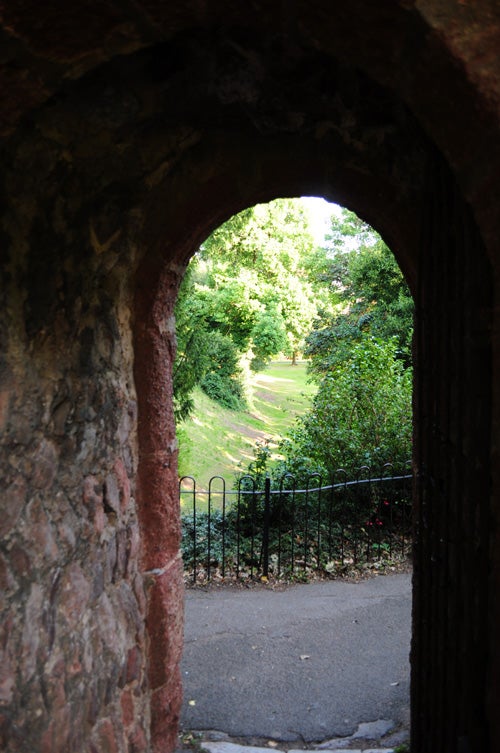 Photograph taken with Nikon D5000 showing a park through an archway.
