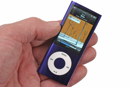 Hand holding a purple Apple iPod nano 5th Gen 8GB.
