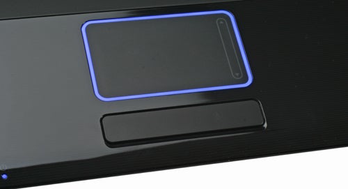 Samsung R620 laptop touchpad with blue light trim.