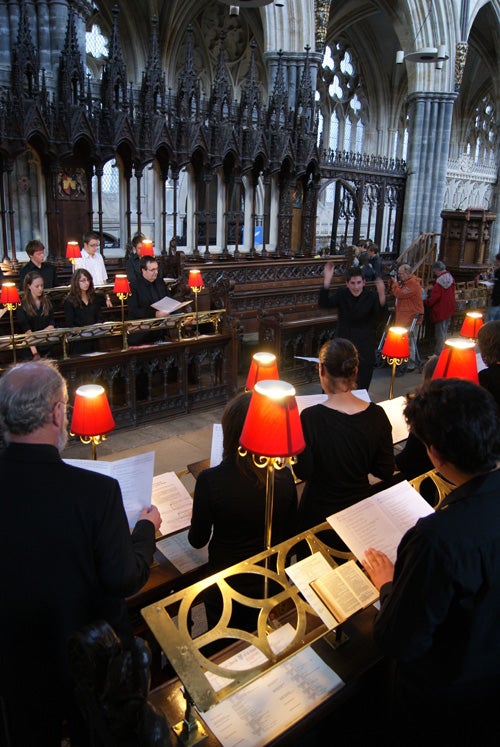 Choir practice inside a historical church building.