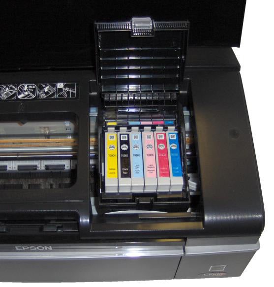 Epson Stylus Photo P50 printer with open ink cartridge compartment.