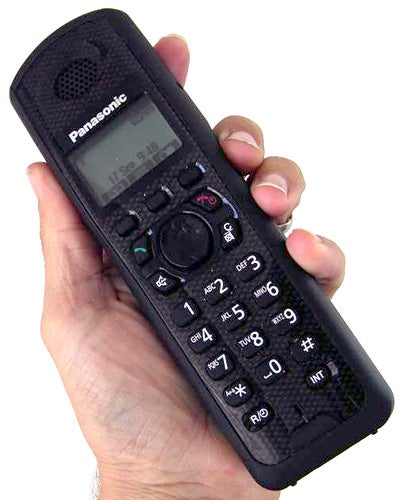 Hand holding Panasonic KX-TG6481ET Rugged DECT Phone.