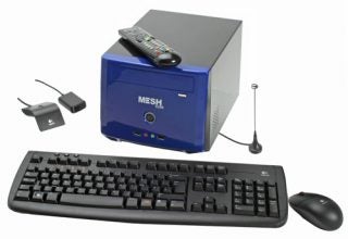 Small form factor Mesh PC with keyboard, mouse, and accessories.