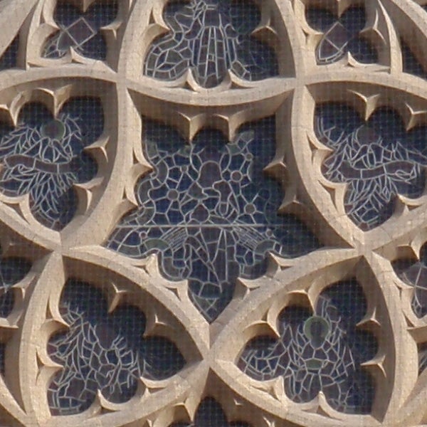 Intricate stone filigree pattern on architecture