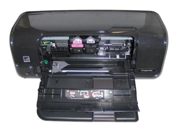 HP Deskjet D1660 inkjet printer with open cover.