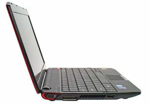 Acer Ferrari One netbook with red detailing open on a white background.