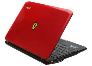 Acer Ferrari One red netbook with logo on cover.