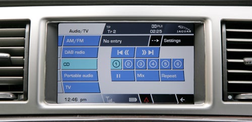Jaguar XF infotainment system display with audio options.