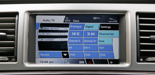 Jaguar XF infotainment system displaying radio channels.
