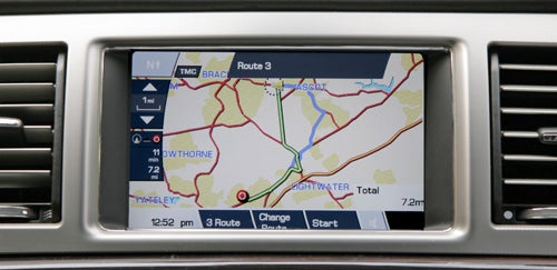 Jaguar XF navigation system display showing map route.