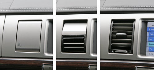 Jaguar XF dashboard air vents and infotainment screen detail.