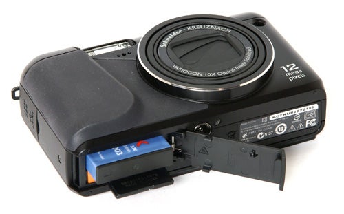 Kodak EasyShare Z950 camera with open battery compartment.