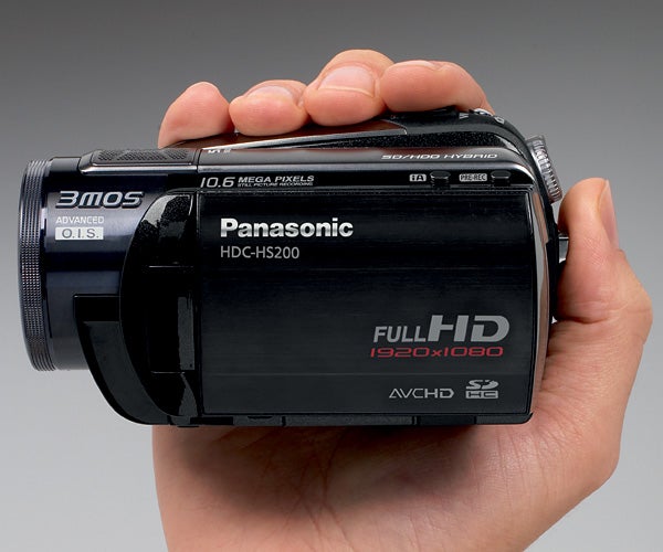 Hand holding a Panasonic HDC-HS200 camcorder.