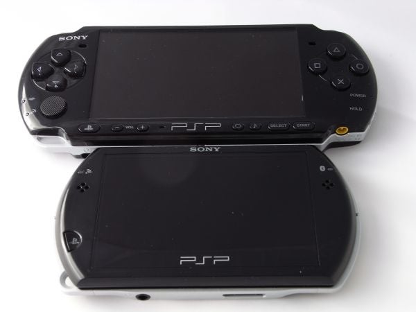 Two Sony PSPgo consoles on white background.