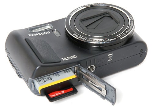 Samsung WB500 camera with battery compartment open.