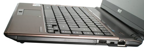 Acer Aspire 3935 laptop angled view showing keyboard and ports.