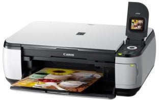 Canon PIXMA MP490 inkjet printer with color printout.