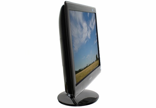 Samsung SyncMaster P2370HD monitor displaying landscape image.