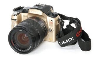 Panasonic Lumix DMC-GH1 camera with lens and strap.