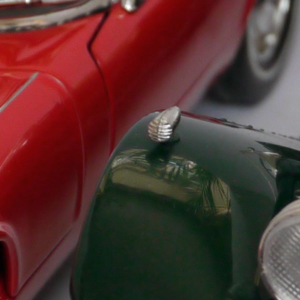 Close-up of two toy cars depicting shallow depth of field.