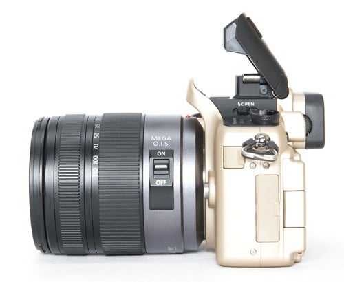 Panasonic Lumix DMC-GH1 camera with flash open on white background.