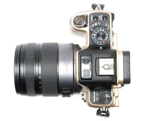 Panasonic Lumix DMC-GH1 camera with lens on white background.