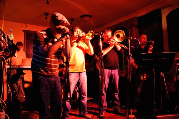 Low-light photo of a band performing indoors taken with Nikon D300s.