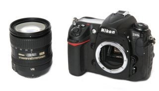 Nikon D300s DSLR with detachable lens displayed.