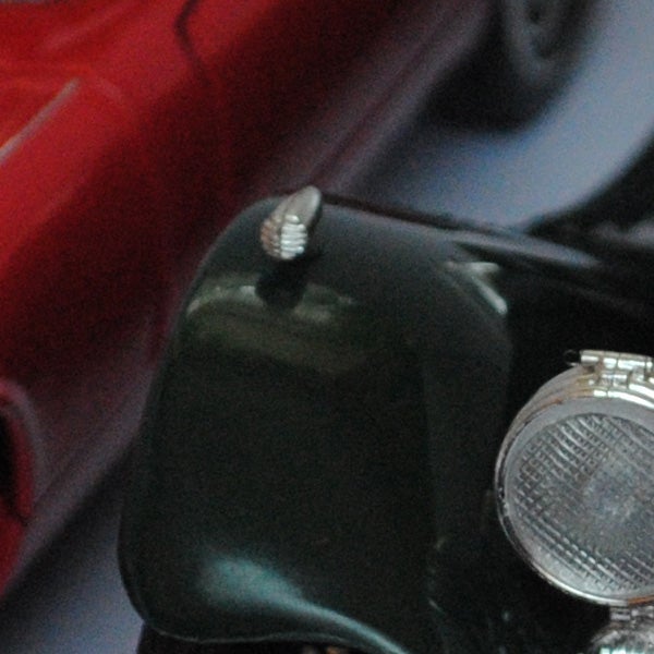 Close-up of a camera part on a blurred background.