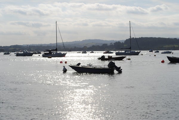 Photo of boats on shimmering water captured with Nikon D3000.