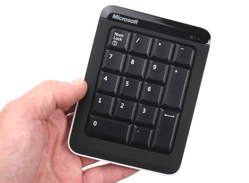 Hand holding Microsoft Bluetooth Mobile Keyboard 6000 numeric pad.