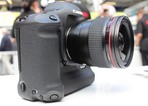 Canon EOS 1D Mk IV camera on display with a lens attached.