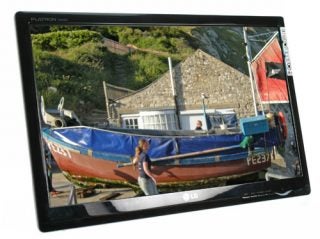 LG Flatron W2230S monitor displaying a vivid boat image.