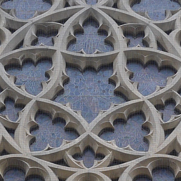 Decorative stone screen with symmetrical pattern design.