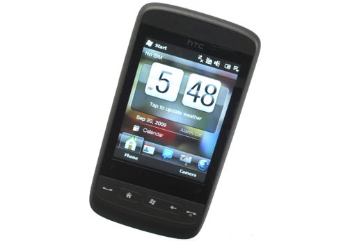HTC Touch2 smartphone showing time and menu on screen