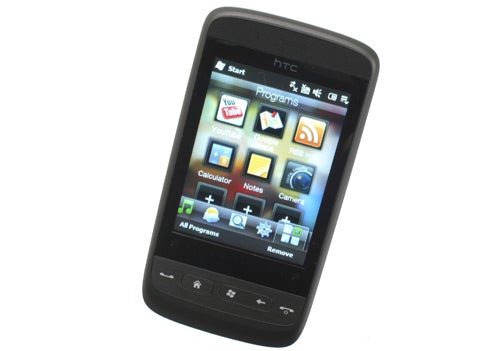HTC Touch2 smartphone displaying home screen with icons.