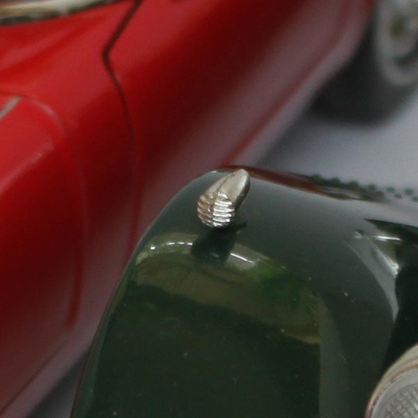 Close-up of a camera's mode dial edge.