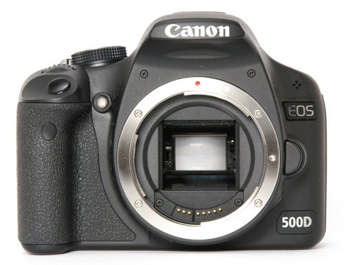 Canon EOS 500D DSLR camera without lens attached.