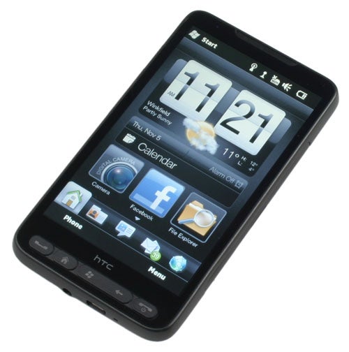 HTC HD2 smartphone displaying time and menu on screen.