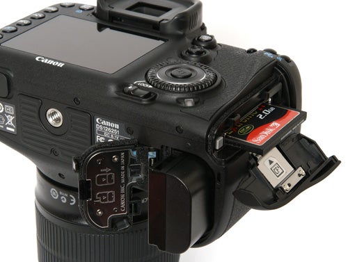 Canon EOS 7D camera showing open memory card slot.