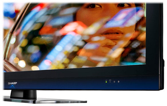 Sharp Aquos LC-46LE700E LED TV displaying colorful on-screen content.
