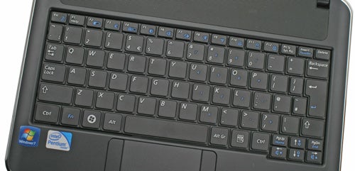 Close-up of Samsung X120 laptop keyboard and stickers.