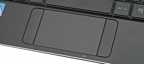 Close-up of Samsung X120 laptop's touchpad and keyboard area.